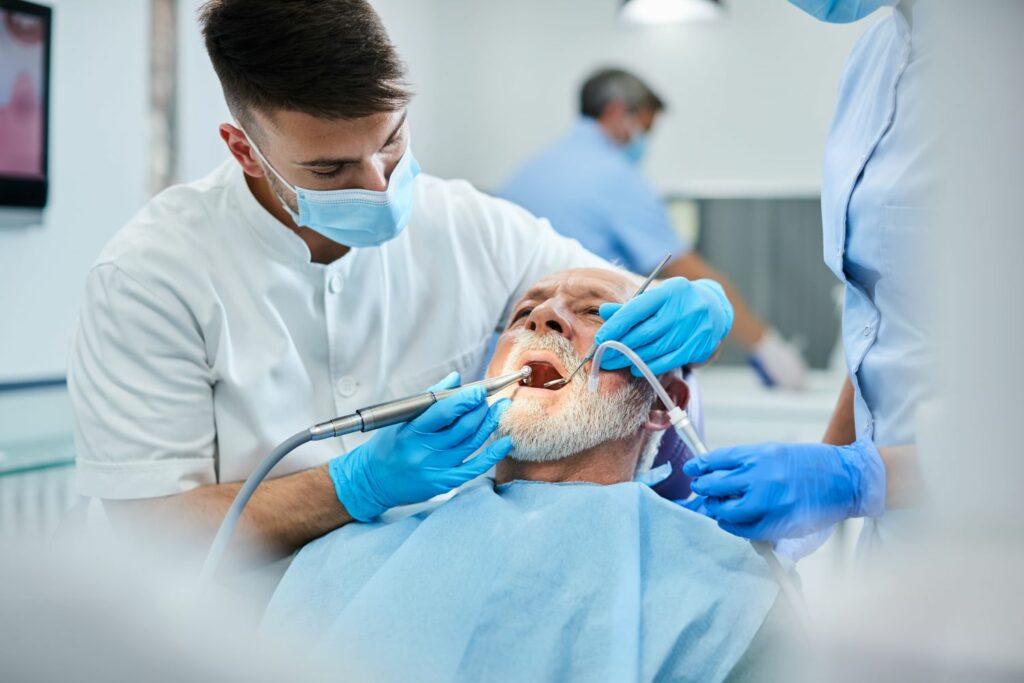 senior man having teeth polish procedure during ap 2022 11 09 03 48 34 utc